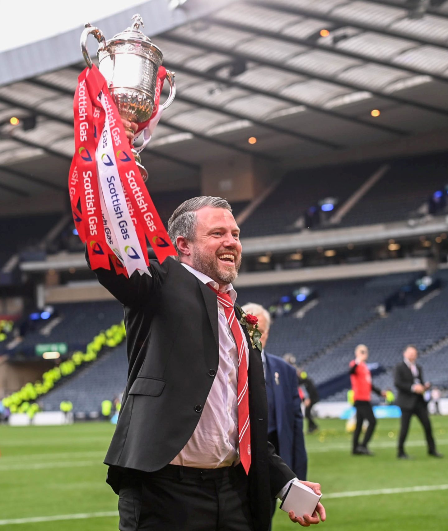Aberdeen manager Jimmy Thelin celebrating with the Scottish Cup after winning against Celtic in the final at Hampden.