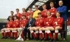Aberdeen FC pose with the Scottish Cup in 1970. Back, from left, Teddy Scott (trainer), Tommy McMillan, Henning Boel, Jim Hermiston, Bobby Clark, Davie Robb, George Murray, Jimmy Bonthrone (assistant manager). Front, from left, Joe Harper, Derek McKay, Jim Forrest, Eddie Turnbull (manager), Martin Buchan (captain), George Buchan and Arthur Graham.