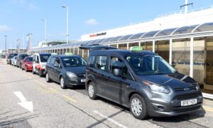 Taxis line up outside Aberdeen Airport. Image: DC Thomson
