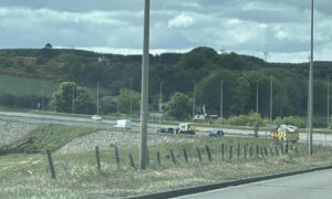Emergency services at scene of crash on A92 at Bridge of Muchalls