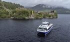 Jacobite Cruises boat on Loch Ness by Urquhart Castle.