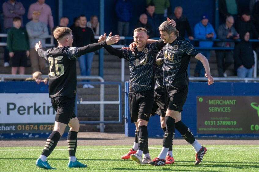 Inverness Caledonian Thistle striker Billy Mckay, centre, celebrates his goal at Montrose in SPFL League One on May 3, 2025, with Alfie Stewart, left, and Charlie Gilmour. 