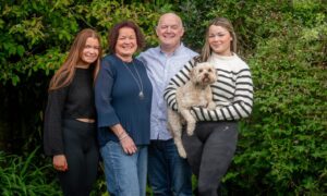 Allen Shaw, centre right, with his wife Kate, centre left, and daughters Megan and Abigail. Mr Shaw will take part in charity fashion show Brave on Thursday and Friday. Image: Kath Flannery/DC Thomson
