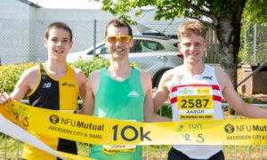 Run Garioch 2025 men's 10km winner John Lenehan, centre, with Fraser Mackenzie (left) and Aaron Odentz (right). Image: Kami Thomson/DC Thomson