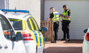 Police officers at Westhill house