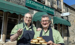 Kingussie butcher Donald Gilmour', left, with colleague Willie Conner. Image: Perthshire Picture Agency