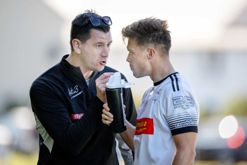 Lovat manager Iain Nicolson gives instructions to Craig Mainland at Balgate, Kiltarlity. Image: Neil G Paterson.
