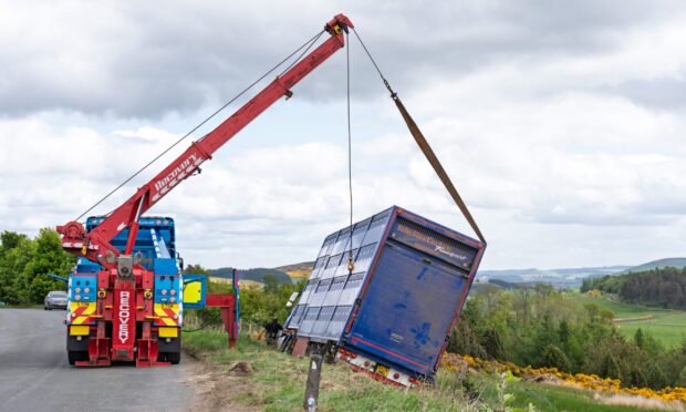 Livestock carrier truck being recovered