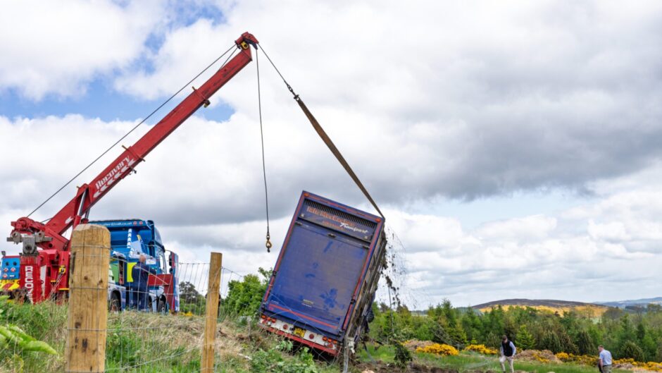 Livestock carrier truck being recovered