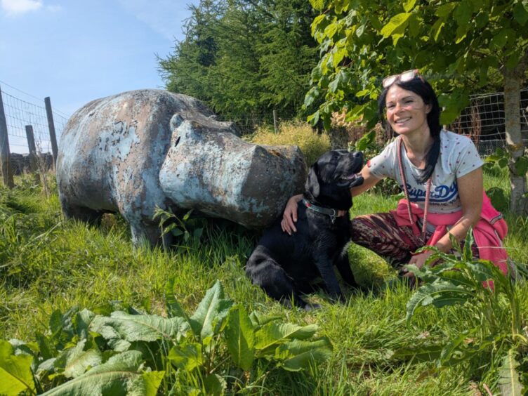 Gayle and Labrador Dante with the fabled Ellon hippo.