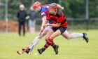 Oban's Daniel MacVicar with Calum Grant (Kingussie). Image: Neil Paterson.