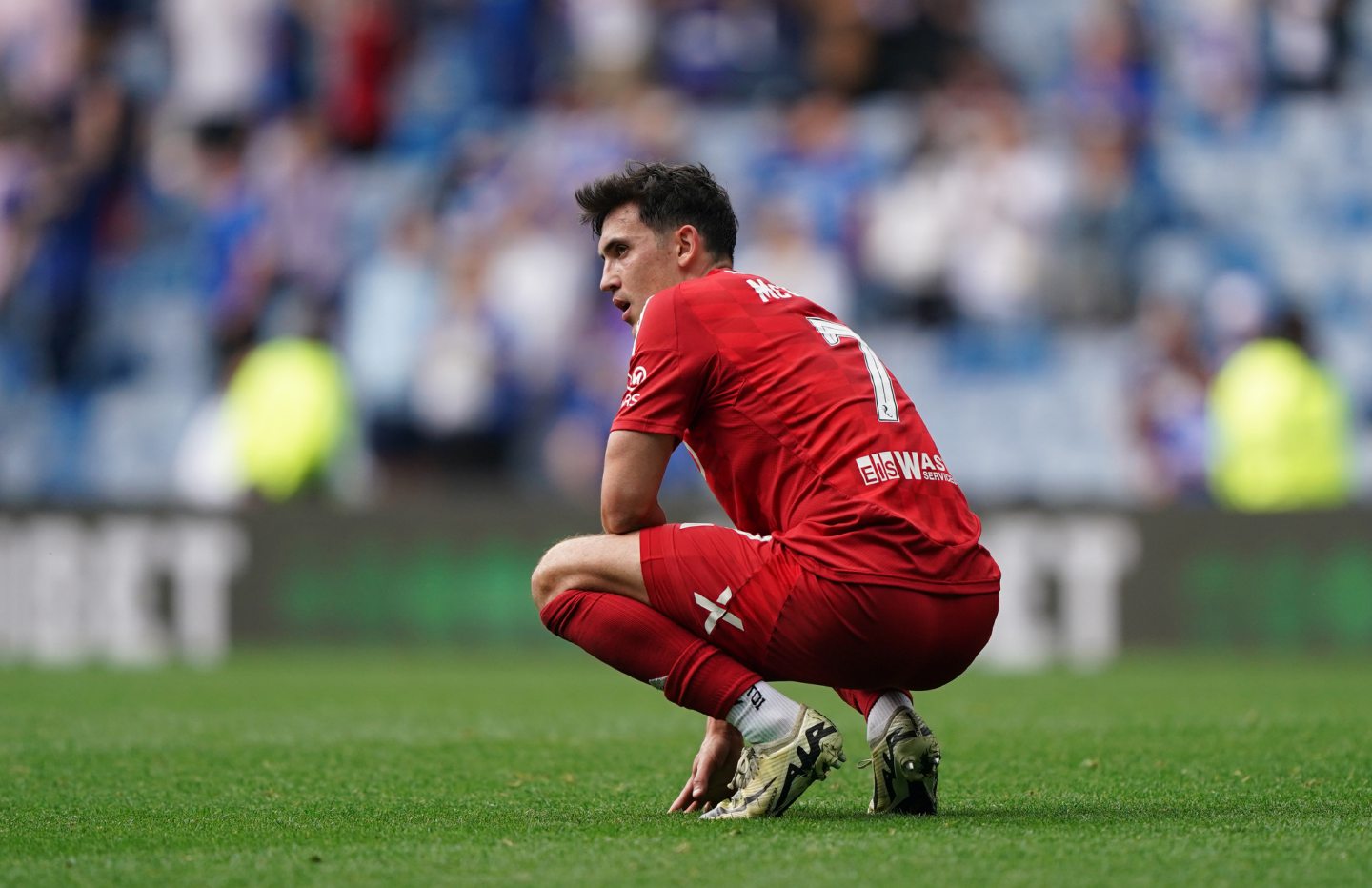 Aberdeen midfielder Jamie McGrath dejected in the 4-0 loss to Rangers at Ibrox.