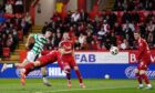 Celtic's Johnny Kenny (left) scores their side's fourth goal of a 5-1 win against Aberdeen at Pittodrie.