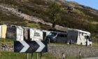Motorhomes parked up at Jimmy Savile's former cottage in Glencoe. Image: Louise Glen/DC Thomson.