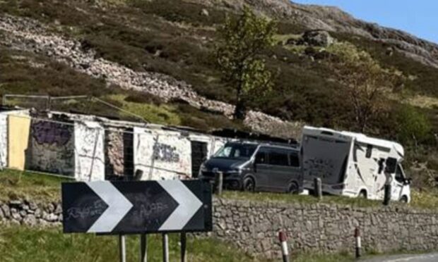 Motorhomes parked up at Jimmy Savile's former cottage in Glencoe. Image: Louise Glen/DC Thomson.