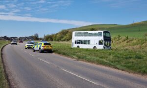 School bus veers off A92. Image: DC Thomson.