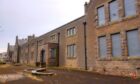 Facade of former Wick High School all boarded up