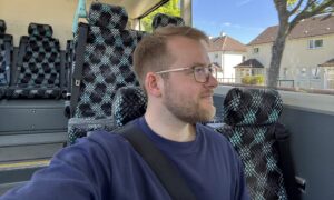 Will Angus sitting on bus.