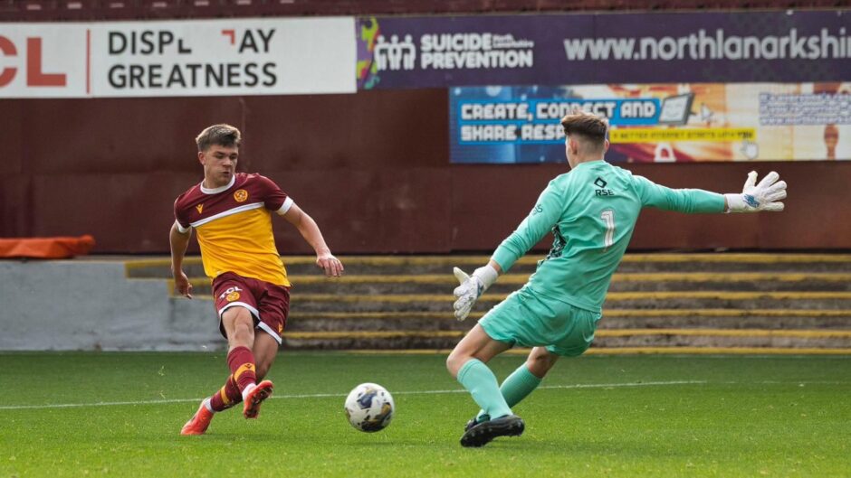 Ross County's Jayden Reid makes a save in a Scottish Youth Cup tie against Motherwell. 