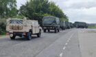Convoy of vehicles of the Belgian Armed Forces entering the Kinloss Barracks