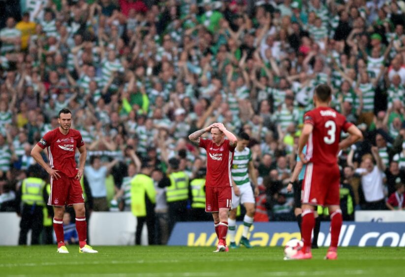 Aberdeen's Andy Considine, Jonny Hayes and Graeme Shinnie as Celtic score to go 2-1 ahead in the 2017 Scottish Cup final. Image: Darrell Benns/DC Thomson.