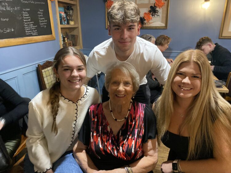 Kenny's mother, Norma Farquharson, alongside Kenny's children Gabriella, Ollie and Holly. 