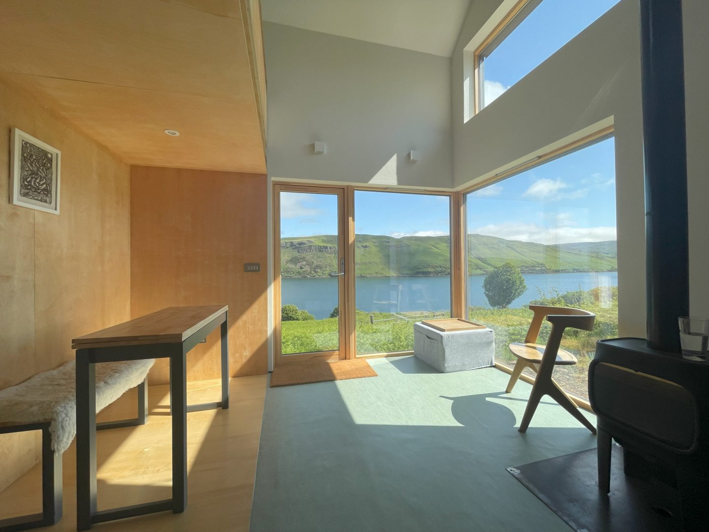 Scotland's Home of the Year's Skye cabin: An interior showing light wood, large windows and great views.