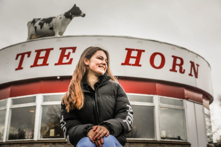 The Horn has appeared in films. Kenny's daughter, Gabriella, who was an extra in one of the films, is pictured outside the diner. 