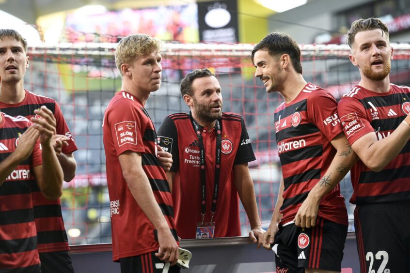 Juan Mata of Western Sydney Wanderers chats with Nicolas Milanovic. Image: Shutterstock.