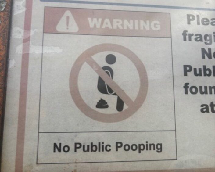 Signpost stating No public pooping.