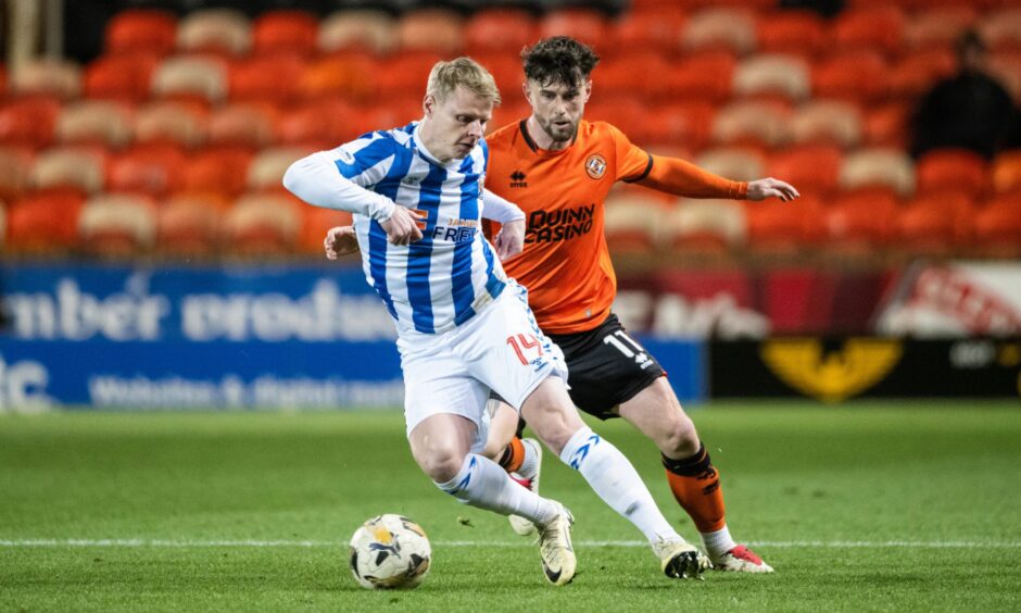 Gary MacKay-Steven (left) in action against Dundee United's Will Ferry.
