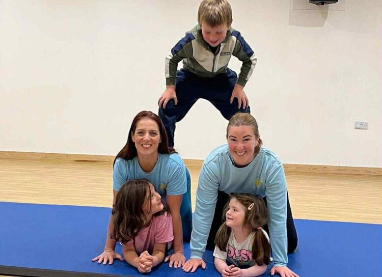 Katie Galbraith and Karen MacDonald with their kids in the gym at the Happy Wee Health Club, Oban. 