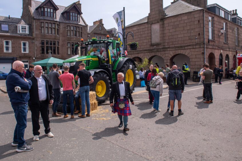 People taking a look at a tractor at the Feein' Market in Stonehaven.