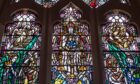 A detail of stained glass panels in King's College Chapel by Douglas Strachan depicting the enthroned Christ and cycle of seasons. Image: Darrell Benns/DC Thomson