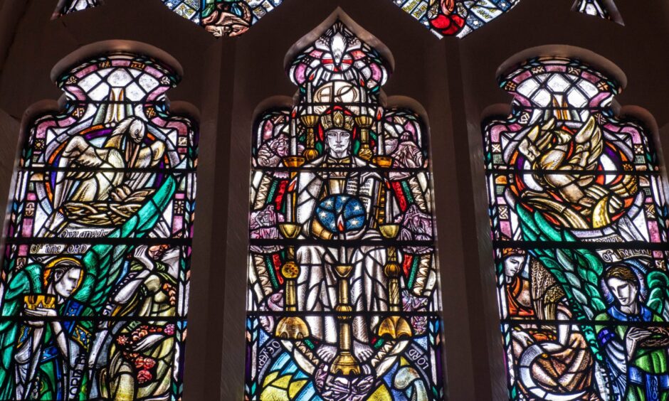 A detail of stained glass panels in King's College Chapel by Douglas Strachan depicting the enthroned Christ and cycle of seasons. Image: Darrell Benns/DC Thomson