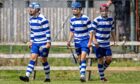 Newtonmore's strikeforce celebrate the late winner from Joe Coyle (centre). Image: Neil G Paterson.