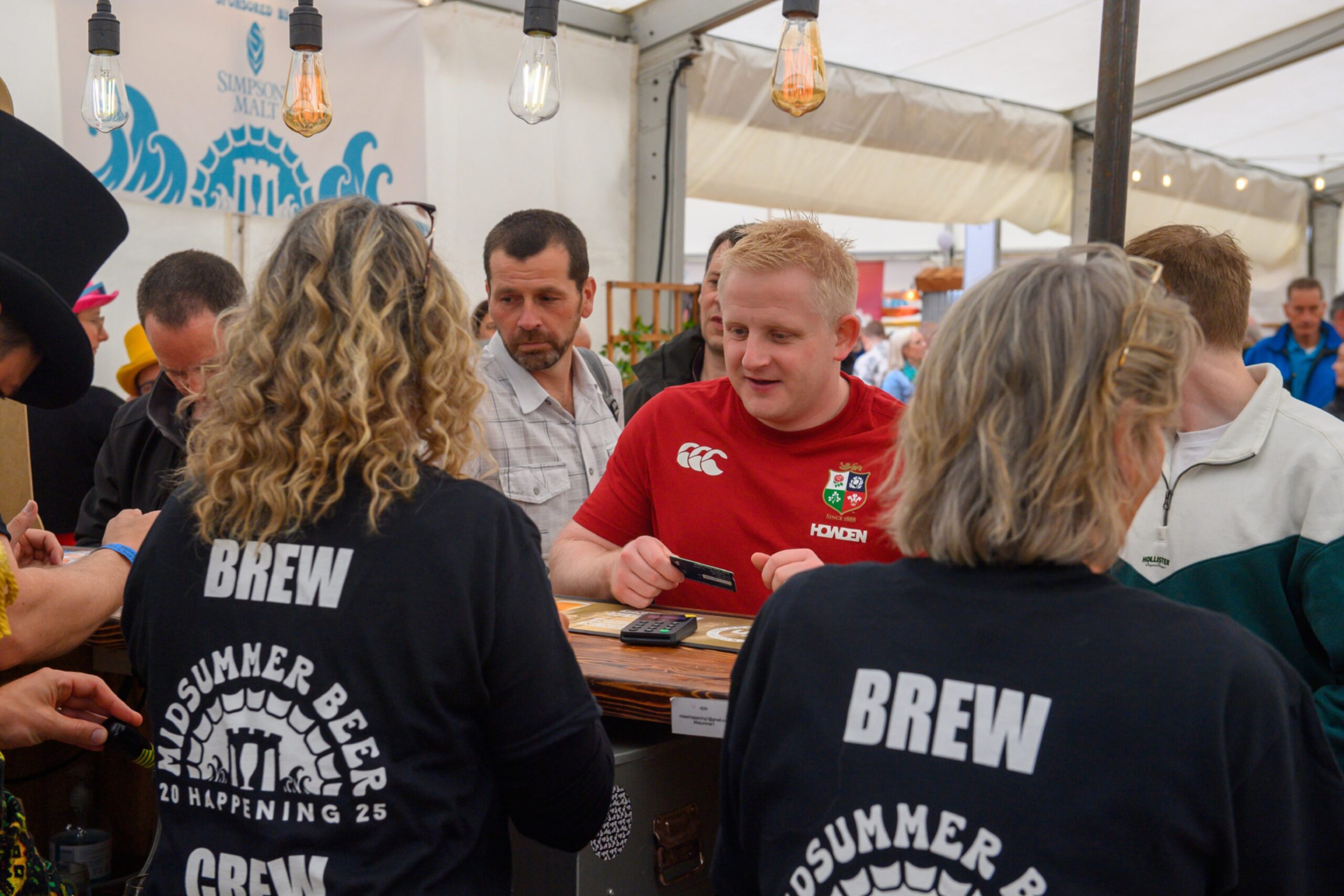 Bartenders serving customers