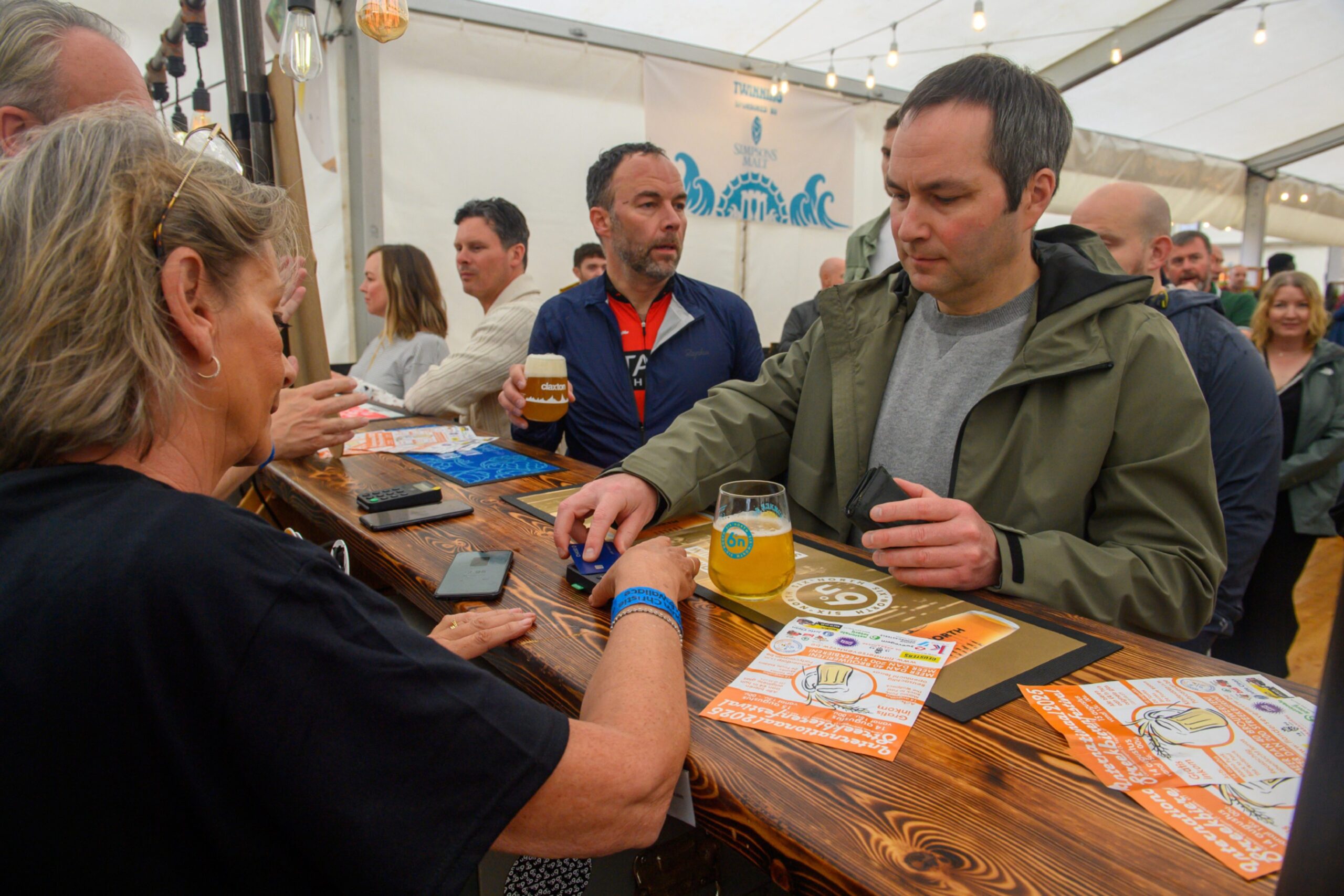 Customers being served at the bar