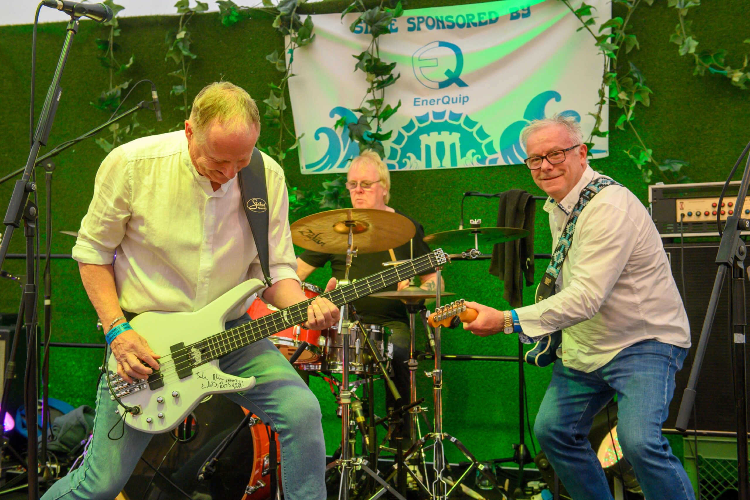 A band with lead singer, drummer and guitarist
