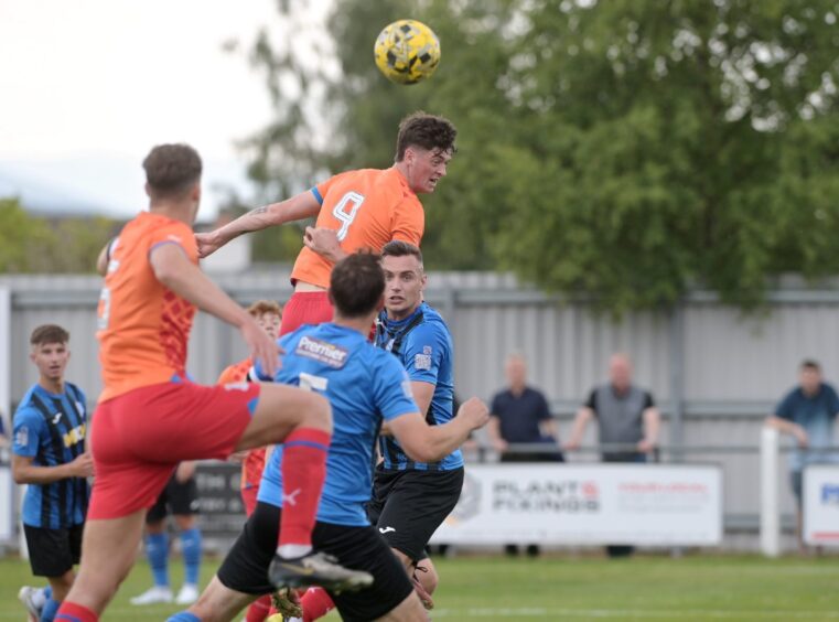 Inverness trialist Charlie Frost rises for a header in a pre-season friendly away to Strathspey Thistle on June 21, 2025.