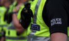 Stock image of police in uniform.