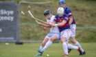 Skye's Dan MacDonald (left) with Rory MacKeachan (Kingussie).  Image: Neil Paterson.
