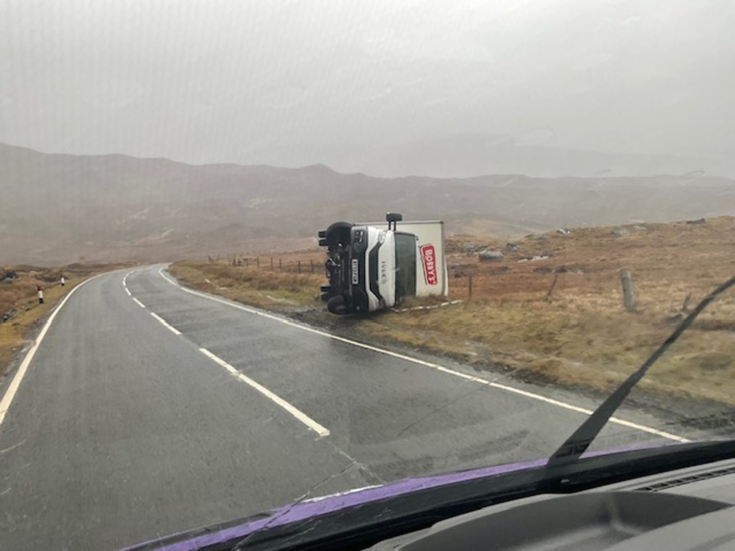 A van knocked on to its side in high winds at Clisham hill.