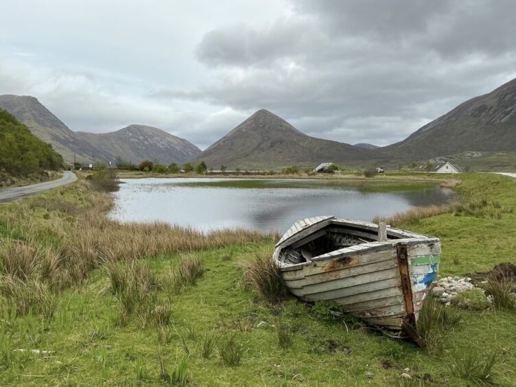 A retired boat rests beside the road between Broadford and Elgol on the Isle of Skye.