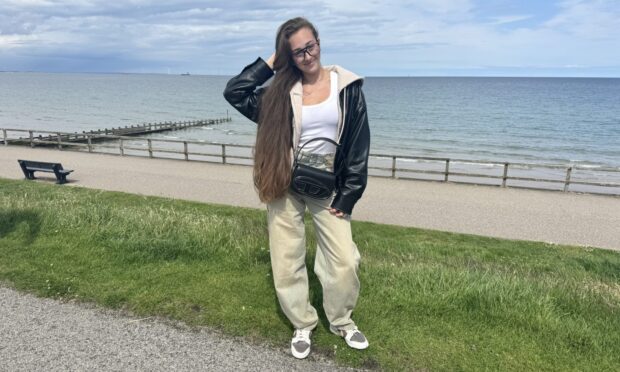 Anastasiia Slobozhaninova and other stylish people show off their looks at Aberdeen beach.
