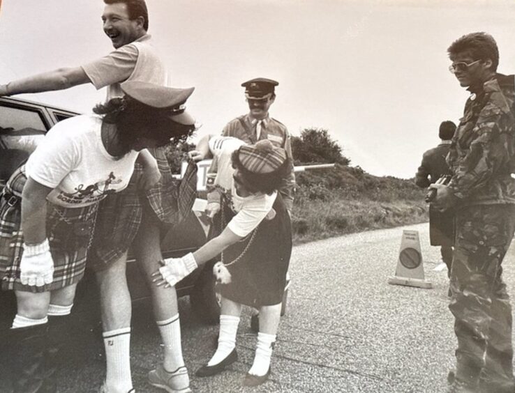 A Free State of Embo Border check, searching for contraband in the form of polo mints and lemons, banned from independent Embo.