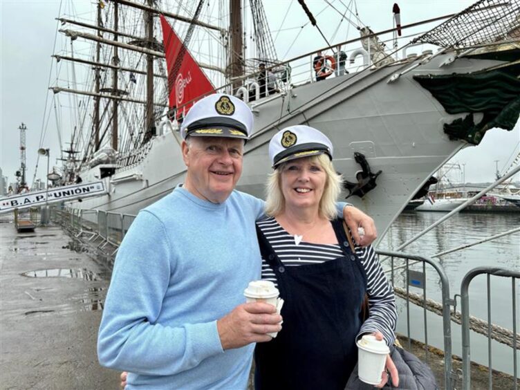 Mike and Lorraine wearing sailor hats 