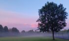Editor's choice: Evening mist tainted pink by late evening sky in Huntly. Image: Richard Brown