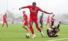 Aberdeen's Kusini Yengi in action during a pre-season friendly match against Cove Rangers.