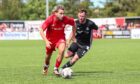 Aberdeen's Adil Aouchiche and Cove Rangers' Mitch Megginson (R) in action. Image: SNS